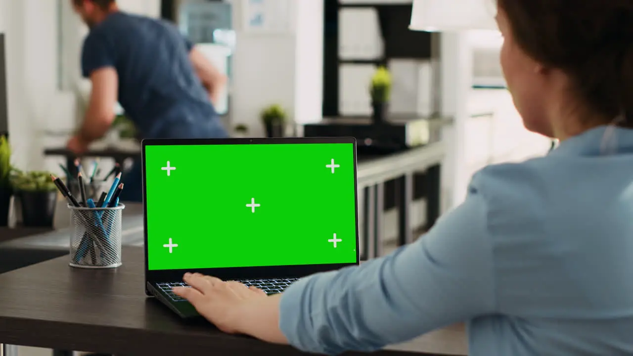 Business person using chromakey laptop