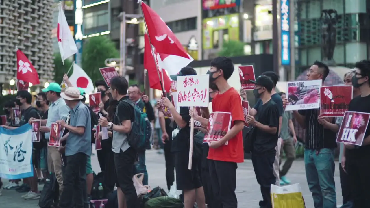 Japan Stand With Hong Kong Japanese People Holding Banners And Flags Of Japan And Hong Kong To Show Their Support In The Solidarity Protest In Tokyo wide slowmo shot