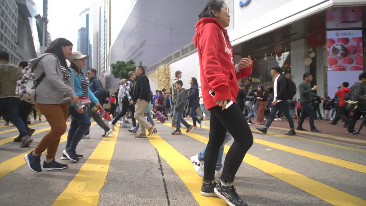 Pedestrians Crossing Street in Hong Kong