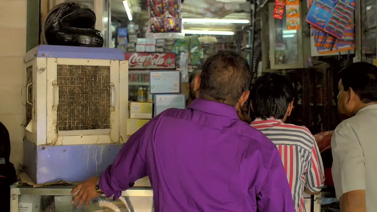 Panning Shot Across Indian Newsagent Shopfront