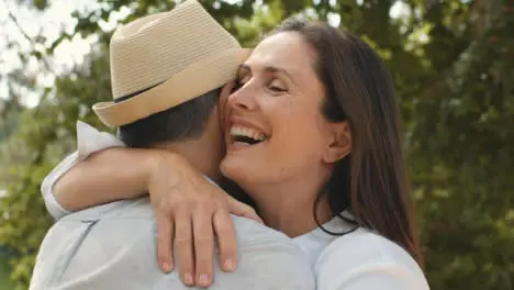 Close Up Shot of Middle Aged Friends Hugging and Embracing