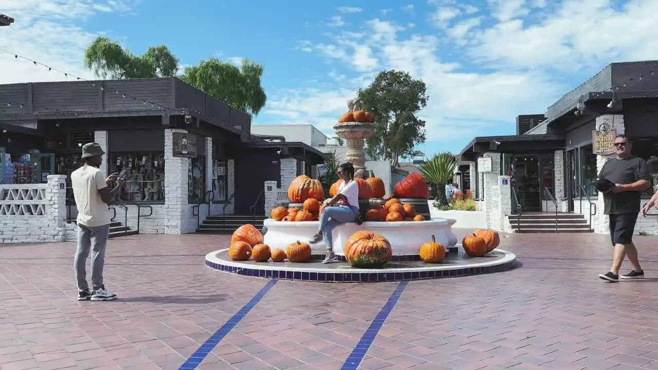 Seaport Village San Diego Halloween pumpkins around water fountain festive feel California