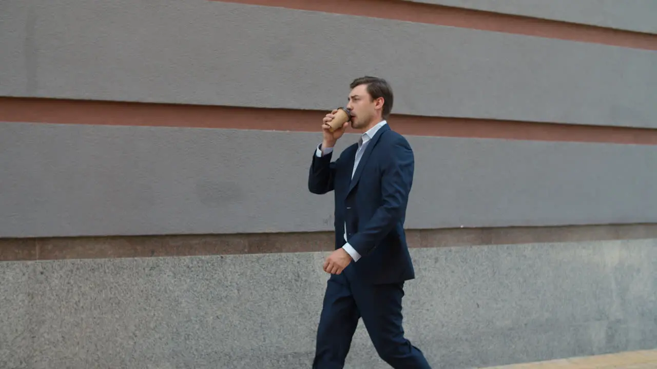 Side view business man drinking coffee to go Man drinking take away coffee