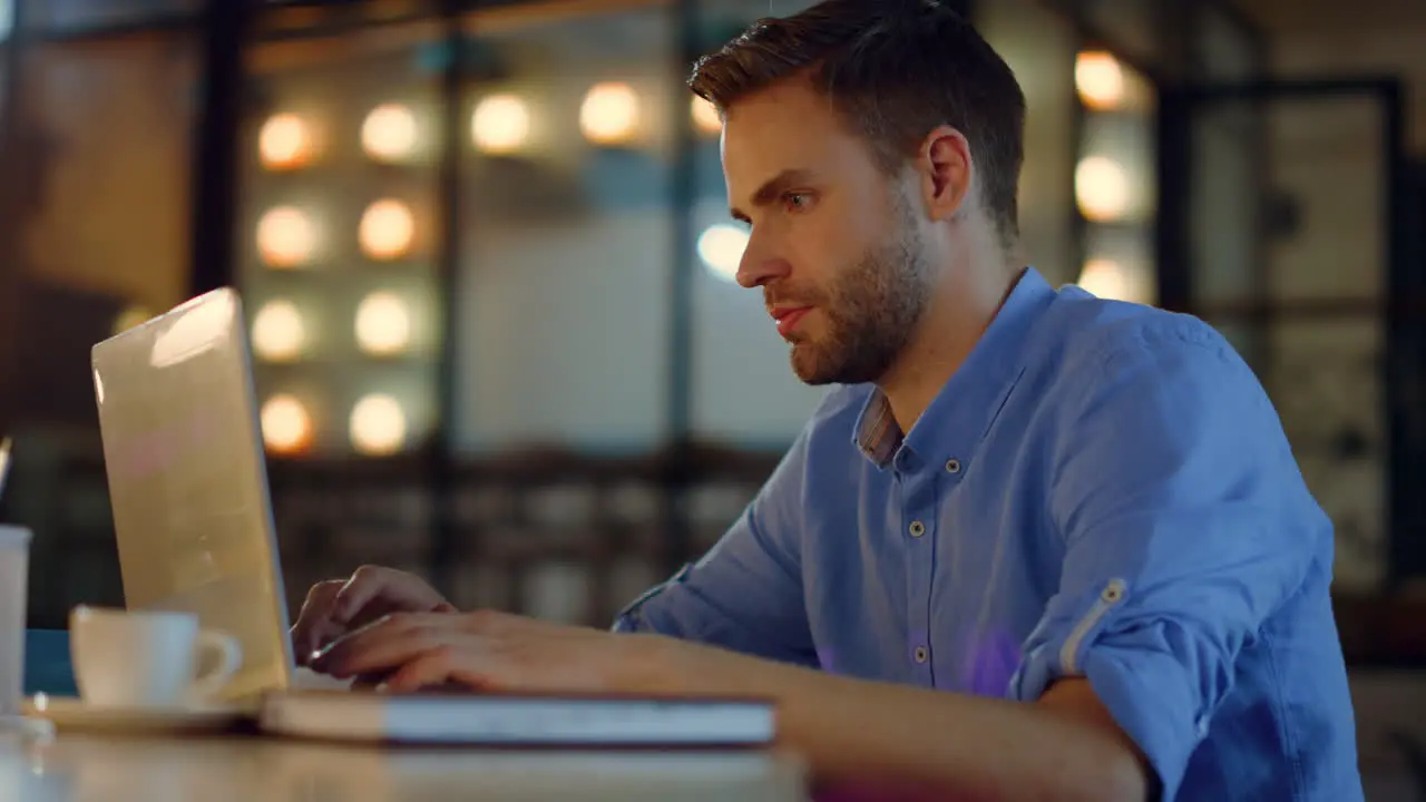 Business man typing on laptop in office Tired entrepreneur working on computer