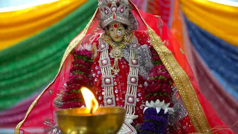 Lit Brass Lamp With Hindu Goddess Durga Mata Ji At Celebration Of Navratri