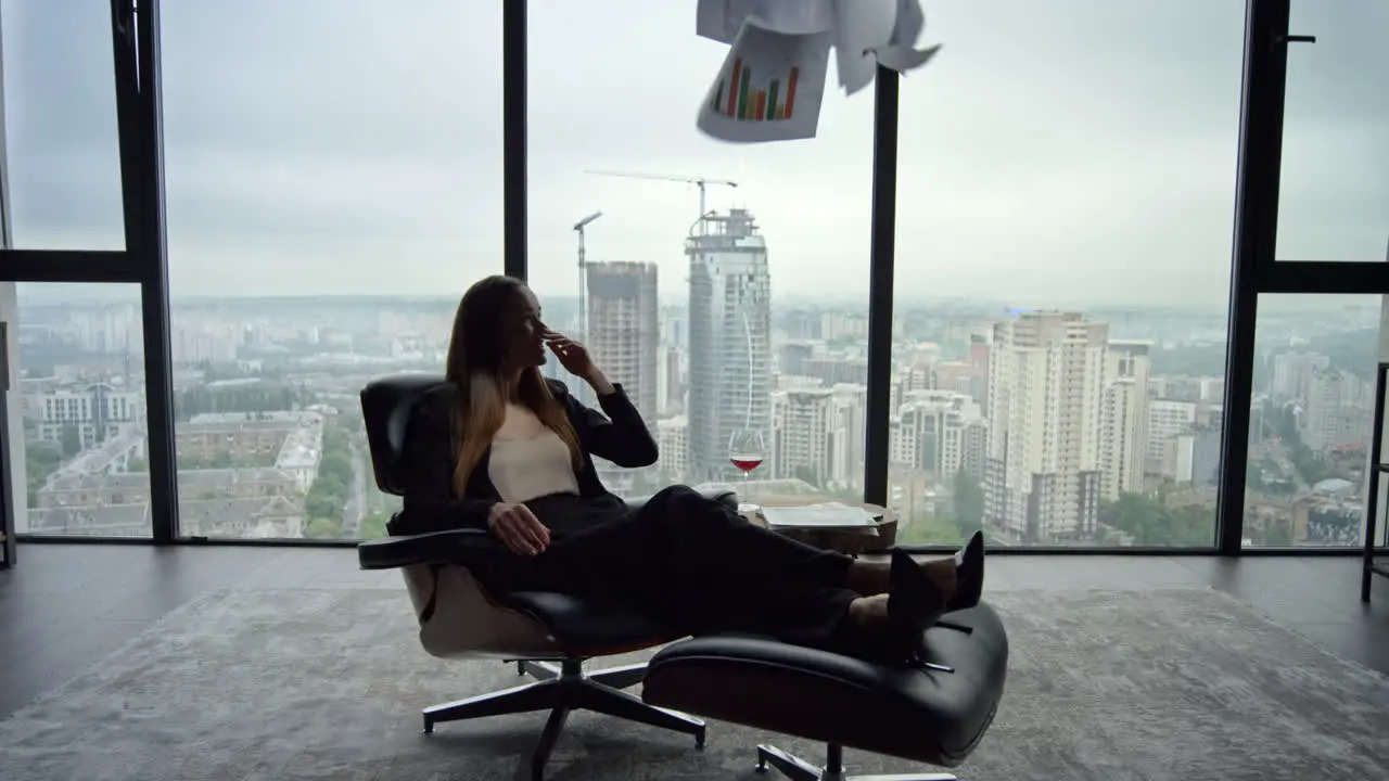 Businesswoman reading business papers in office Professional throwing documents