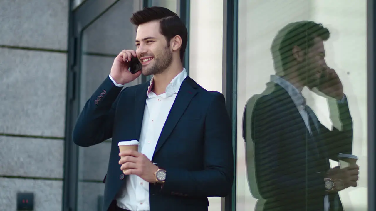 Closeup businessman smiling outdoors Businessman drinking take away coffee