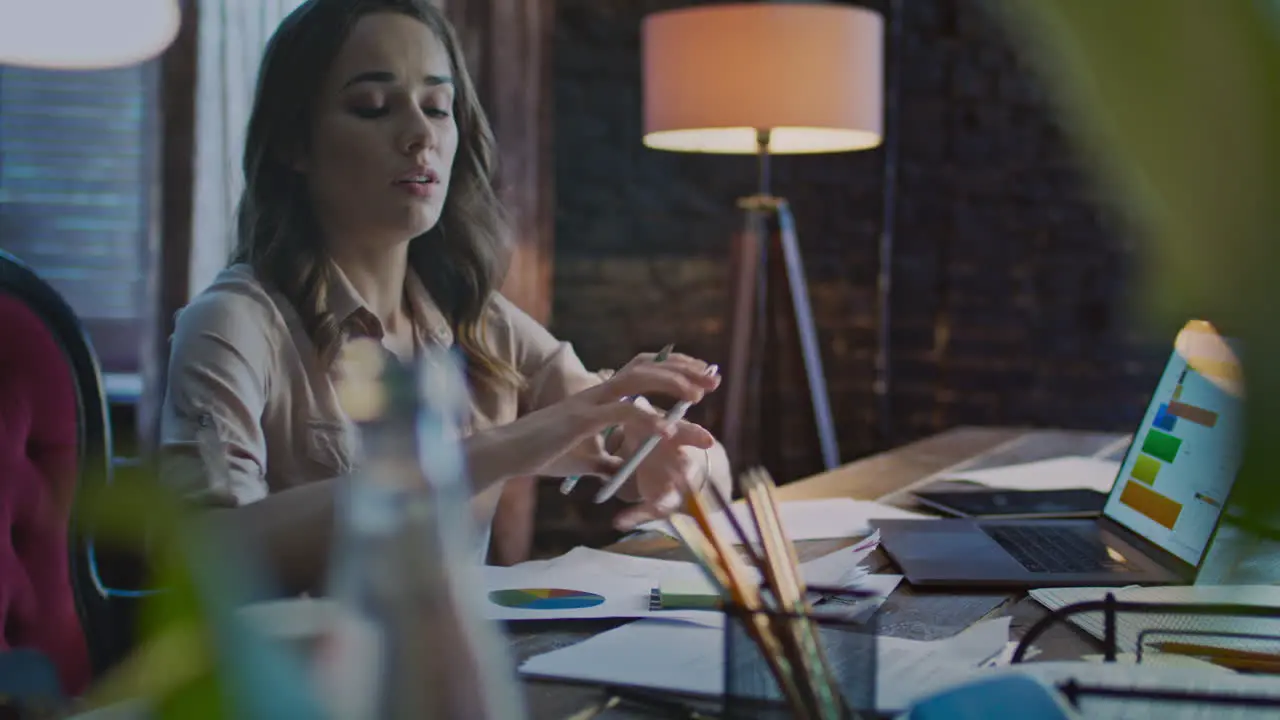 Concentrated businesswoman making notes on paper Hurry specialist answer call