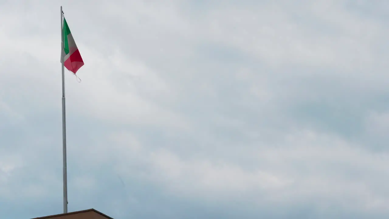 Italian Flag Waving On Top Of A Building In Rome