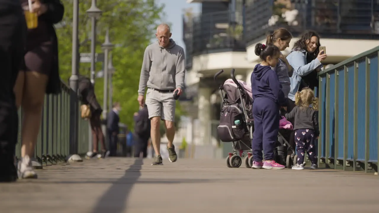 Elder man walking with confidence in urban area of London city slow motion view