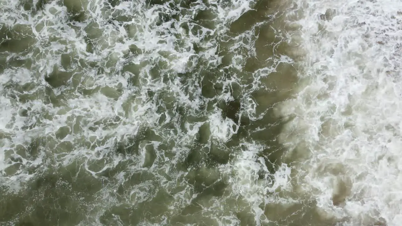 Overhead Shot Of Beautiful Waves Crashing On Sandy Beach California