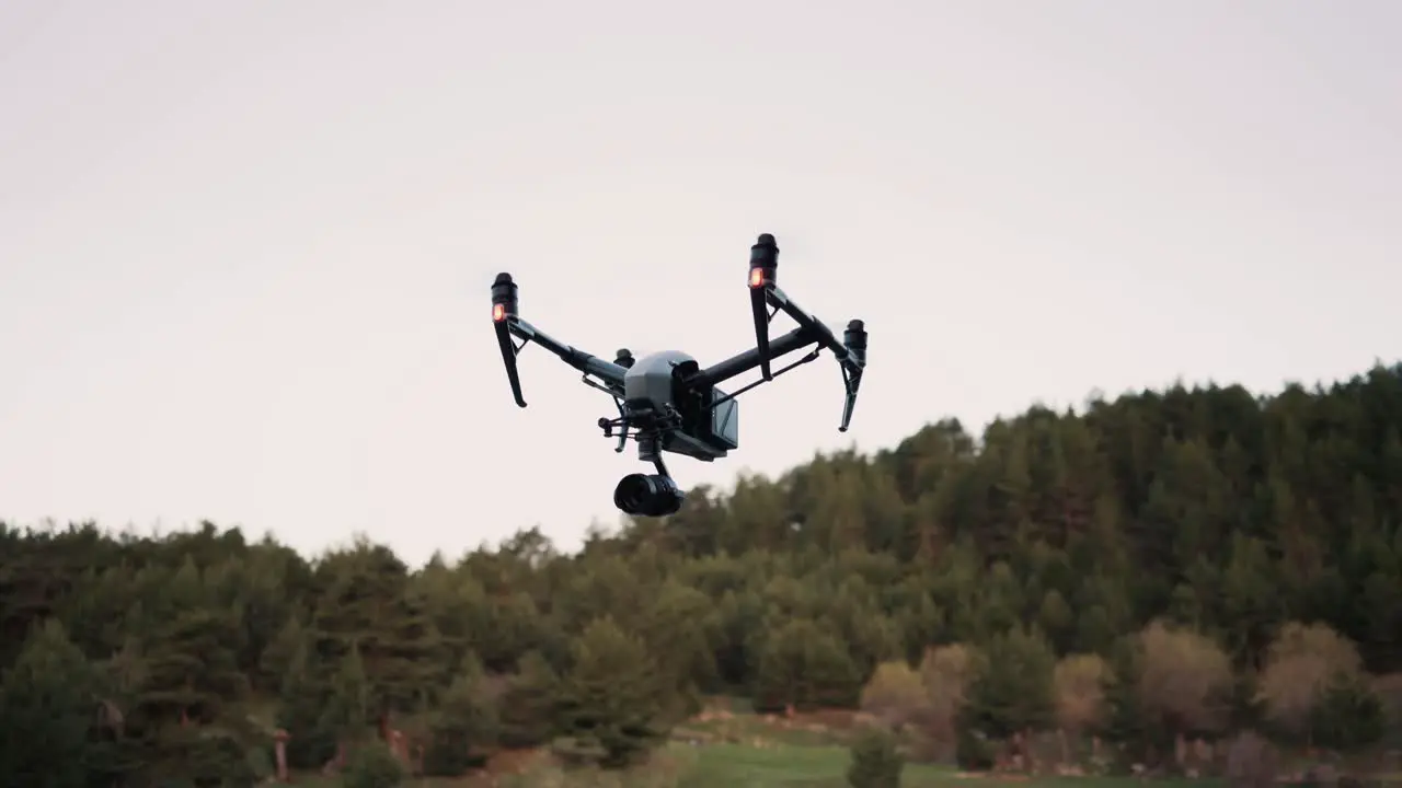 Drone flying in the forest