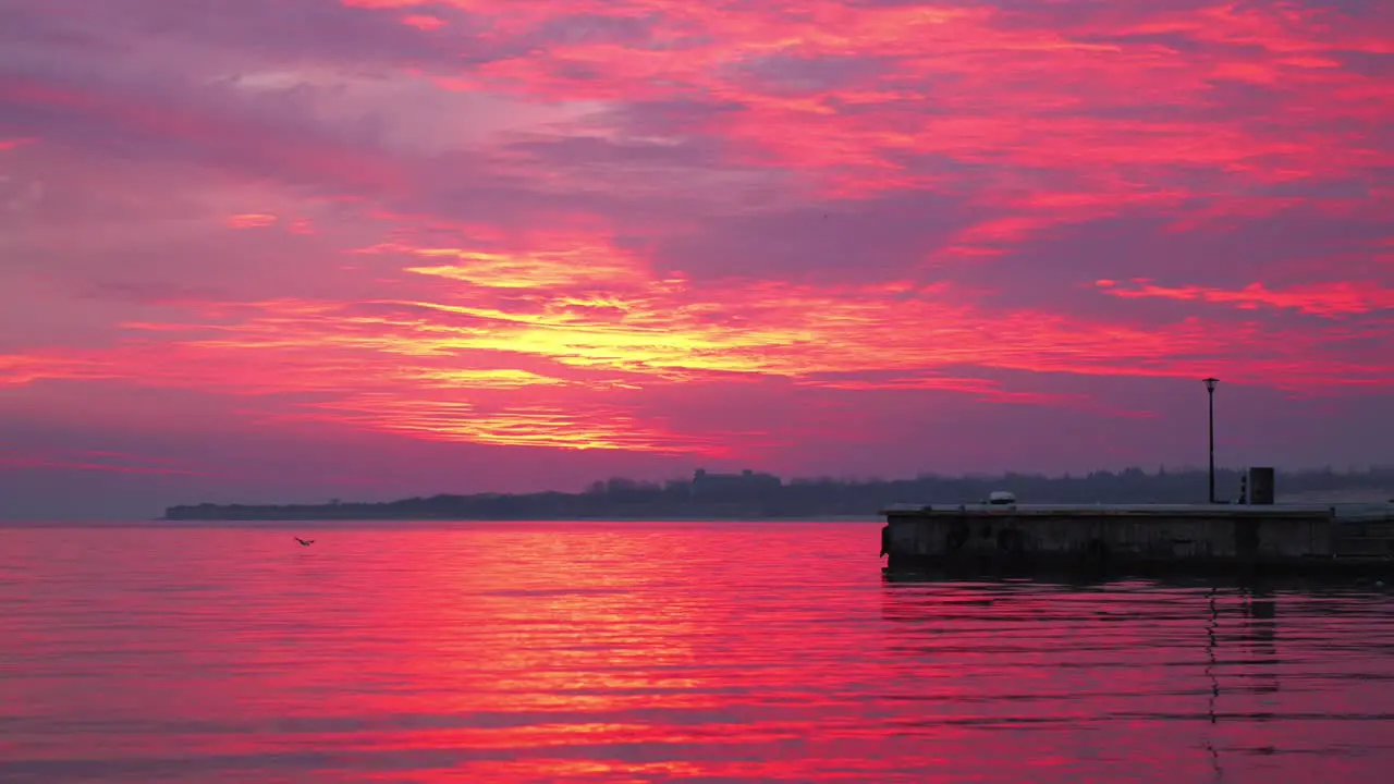 The beautiful red colors of sunset over the waves of Bulgaria wide