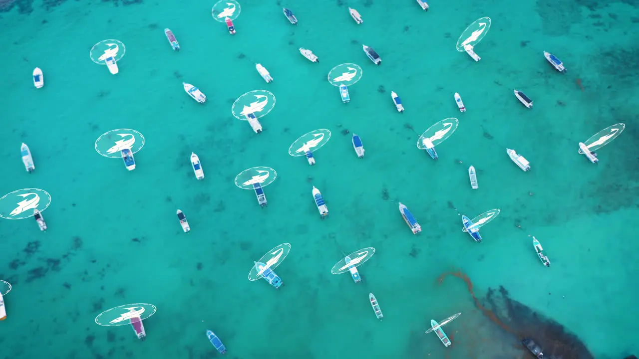 High angle view of fishing boats moored in turquoise water