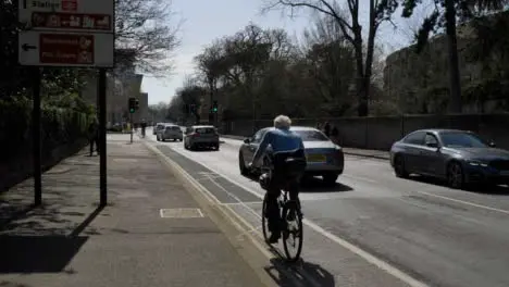 Tracking Shot Following Cyclist and Traffic 