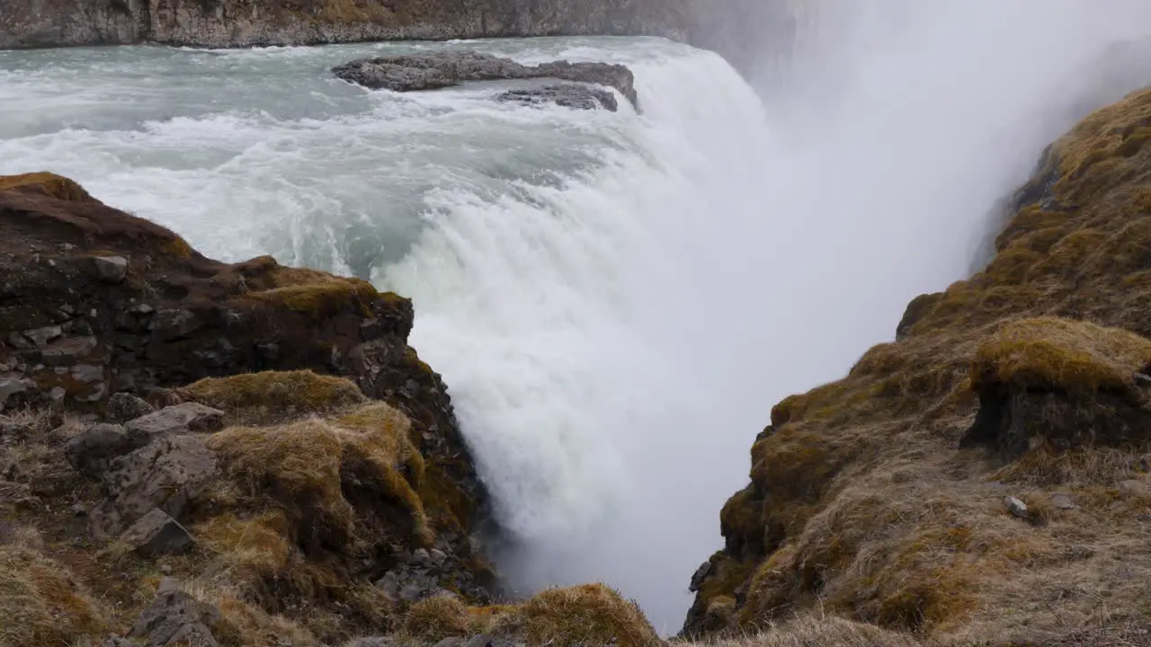 Slowmotion shot of water falling down over the Gulfoss waterfall in Iceland