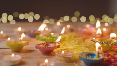 Burning Diya Lamps On Table Decorated To Celebrate Festival Of Diwali 1