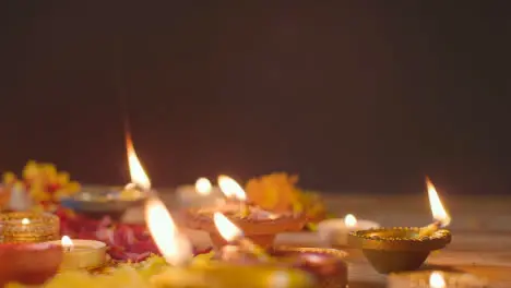 Burning Diya Lamps On Table Decorated To Celebrate Festival Of Diwali 4