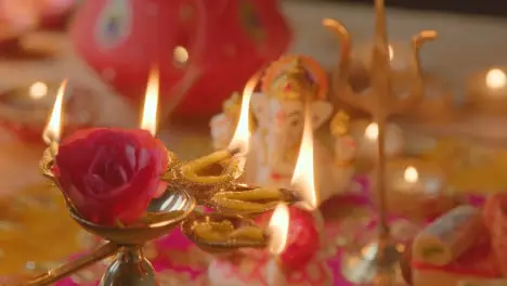 Person Holding Five Wick Lamp With Decorations Celebrating Festival Of Diwali