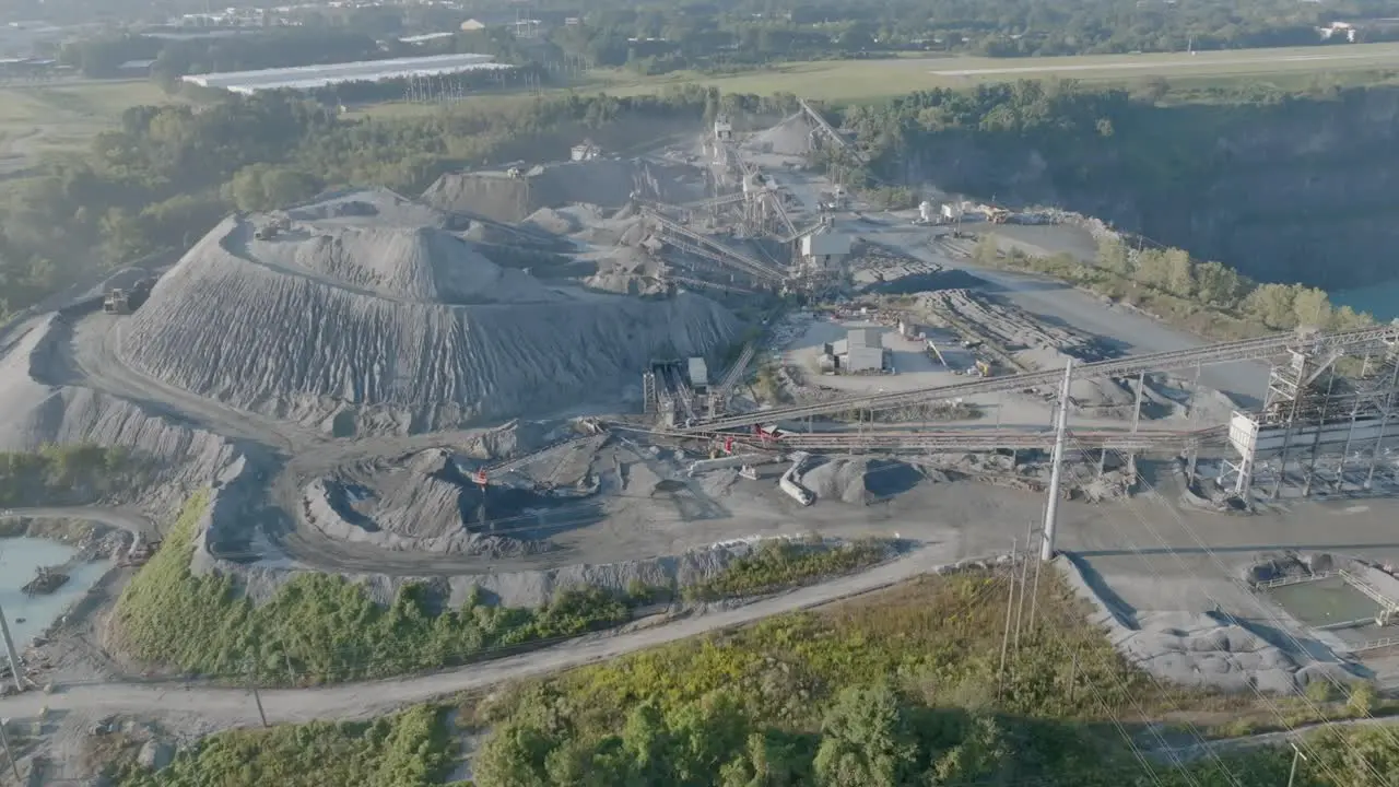 Wide aerial footage of a quarry operation in the early morning in Kennesaw Georgia