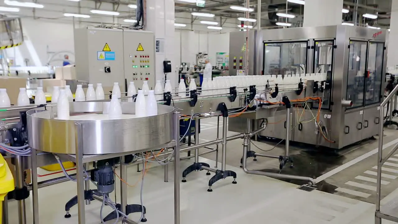 Beverage industry manufacturing line Milk bottles on conveyor belt