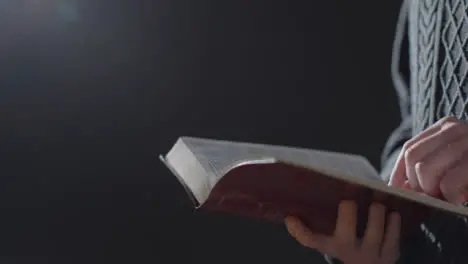 Mid Shot of a Man Reading Holy Bible