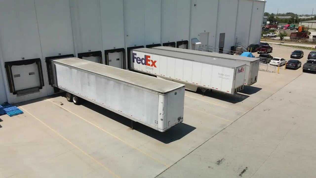 Shipping truck backing into warehouse