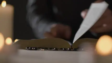 Tracking Shot of a Man Reading Bible