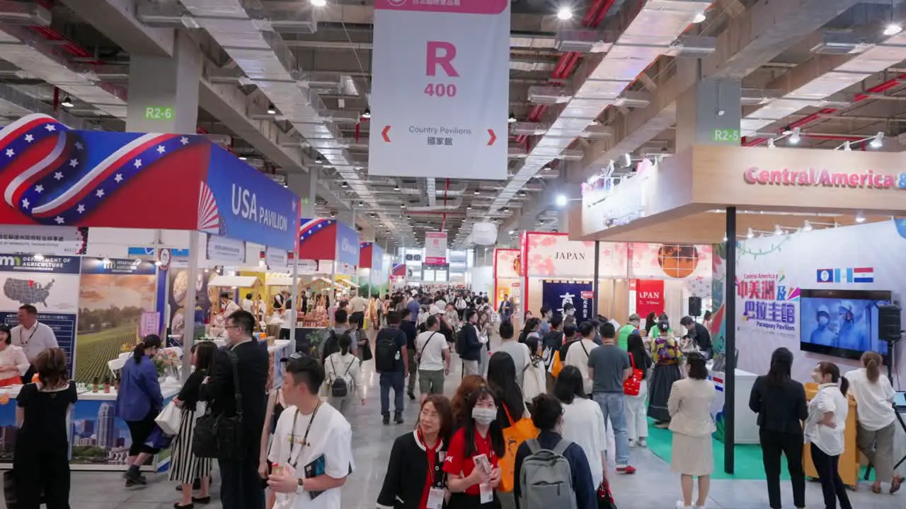 Crowds of people walking around food booth stand featuring Japan and USA