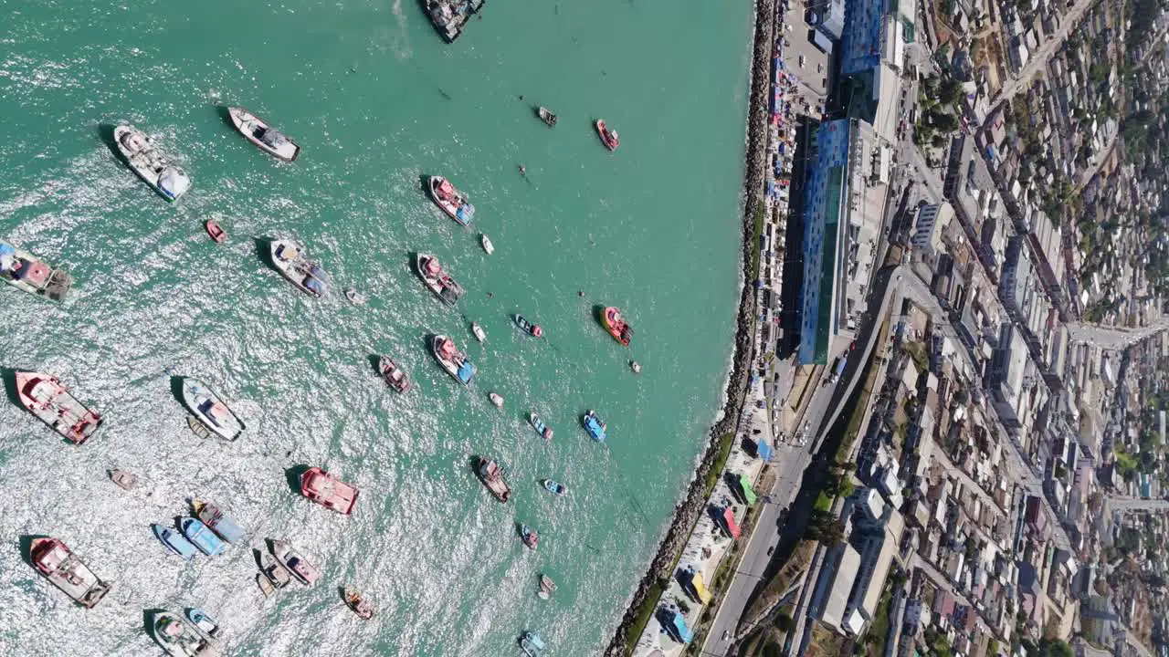 Aerial High Angle View Of Moored Fishing Boats In Port Of San Antonio In Chile