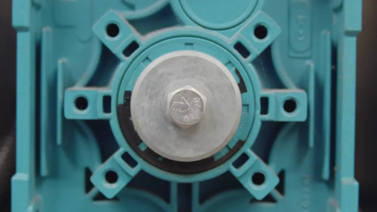 Frontal detail of a rotating screw attached to an electric industrial motor