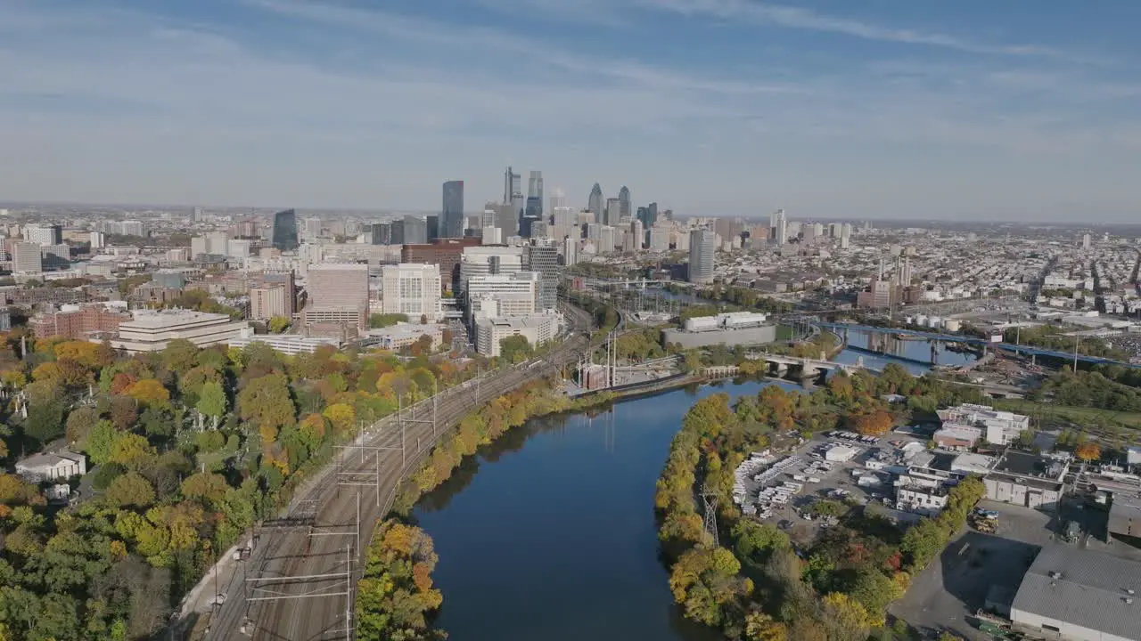 Aerial footage in autumn showing the Schuylkill River meandering towards downtown Philadelphia in the afternoon