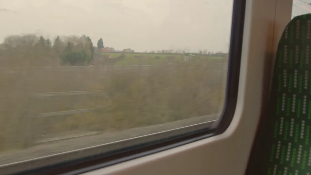 Looking out train window passing road