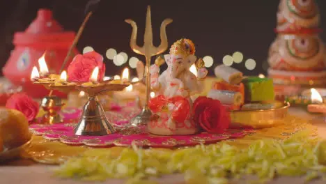 Five Wick Lamp And Statue Of Ganesh On Decorated Table Celebrating Festival Of Diwali 1