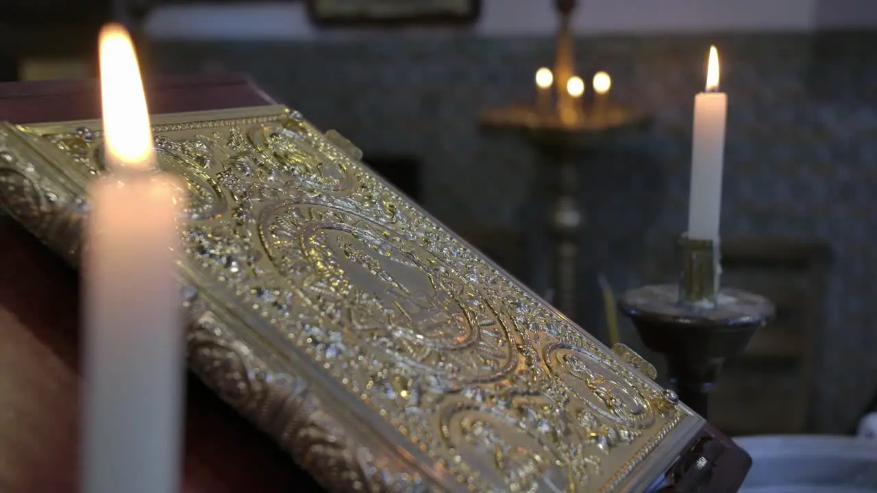 Holly book and candles in church