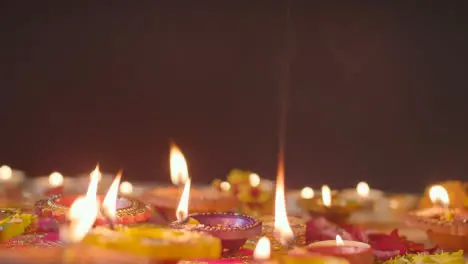 Burning Diya Lamps On Table Decorated To Celebrate Festival Of Diwali 3