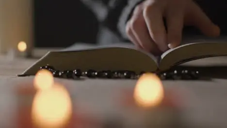 Mid Shot of a Man Reading Bible