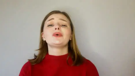 Female Young Student Singing Happy Birthday Directly to Camera During Video Call