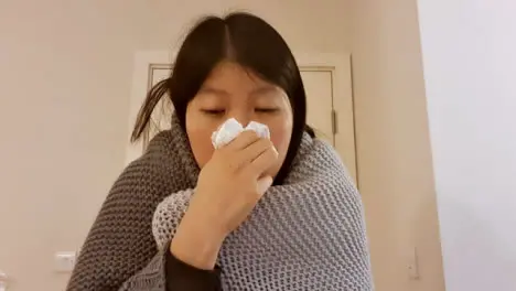 Older Student Looking Visibly Unwell Coughing Whilst Talking to Camera On Video Call