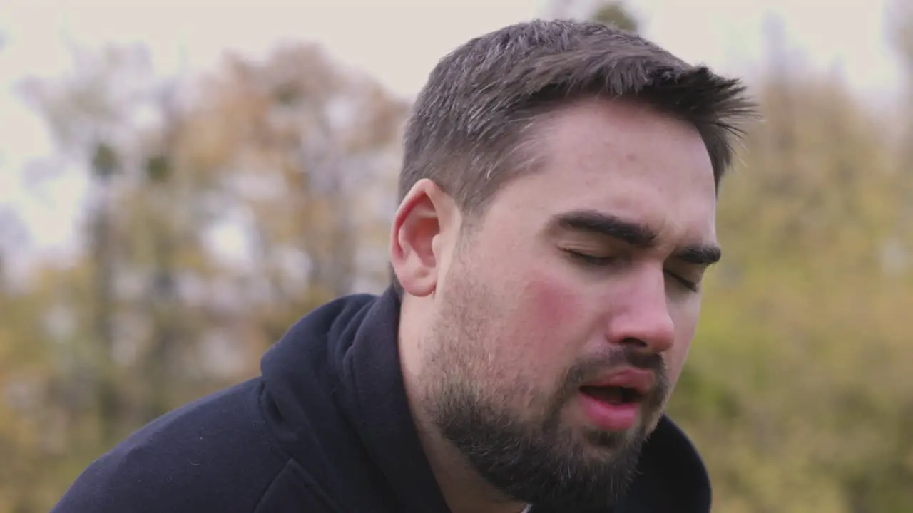 Tired Man Breathing Heavily At Park In The Morning