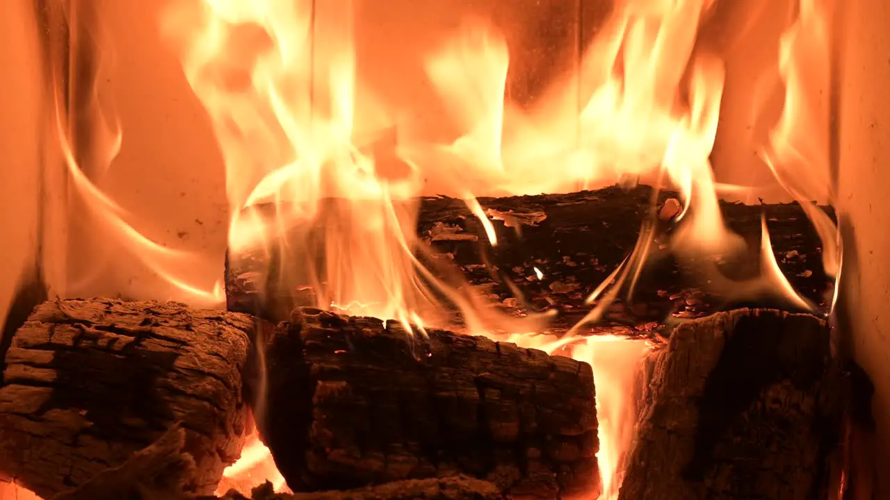 close up of fireplace at rustic home burning woods for heat the house