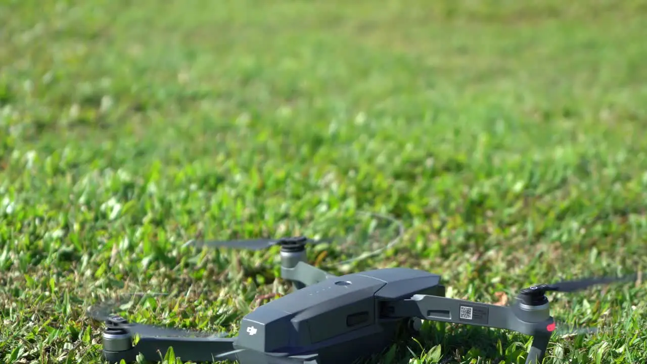 DJI Drone taking off in park on a sunny day