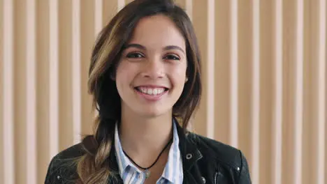 Woman face and smile for portrait in wall