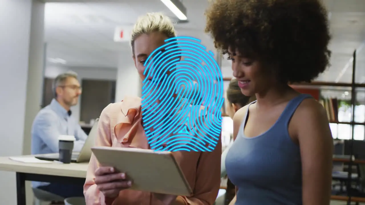 Animation of blue fingerprint over diverse colleagues talking in creative office