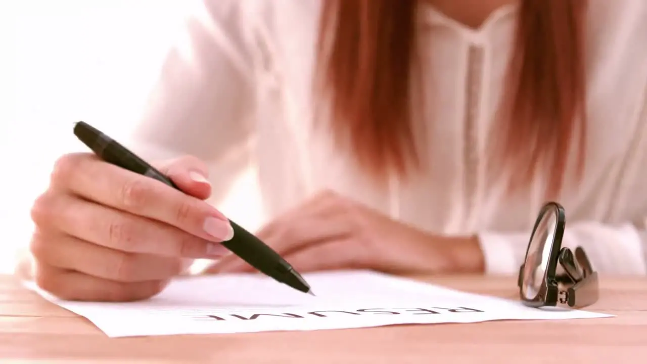 Businesswoman writing a list