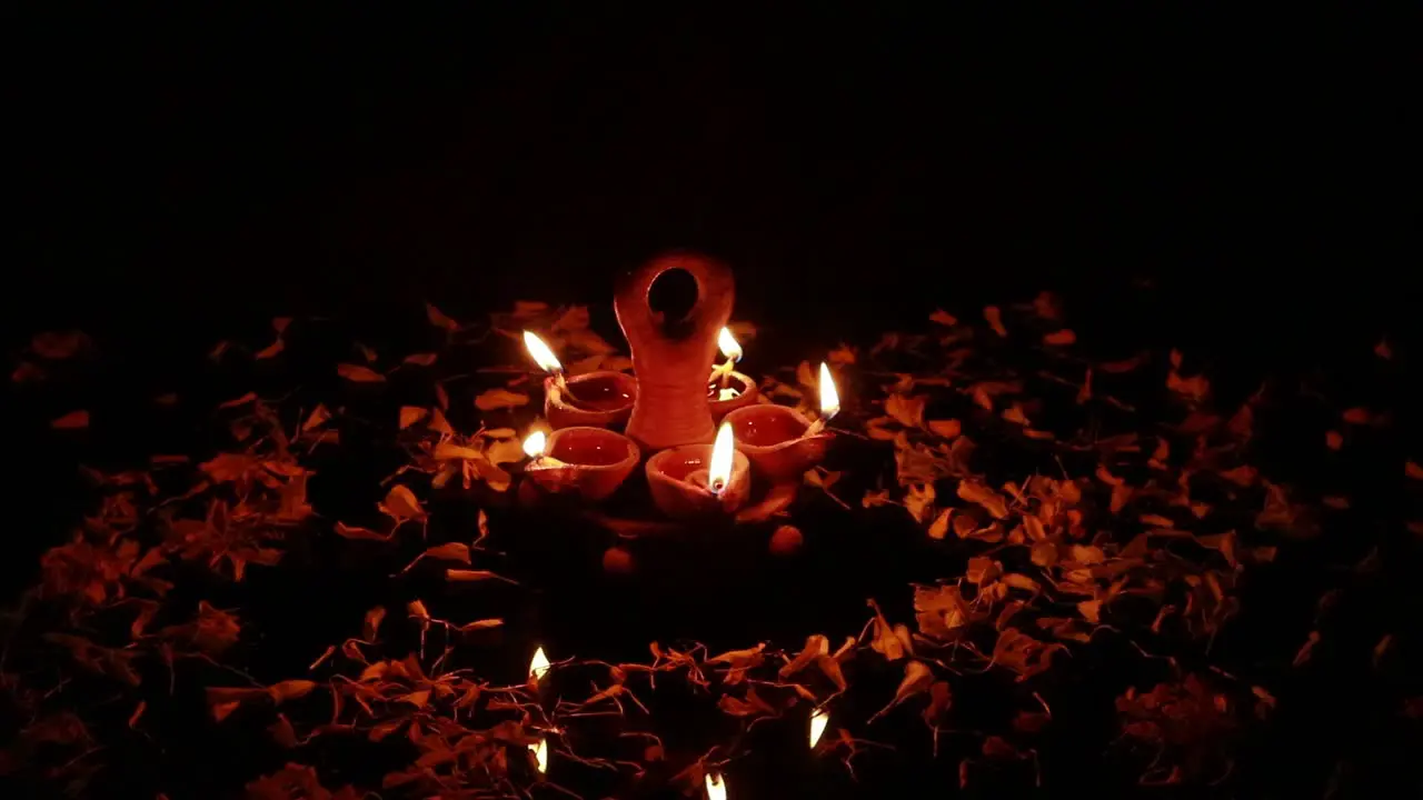 A table decorated with mud lamps for a festival in the dark