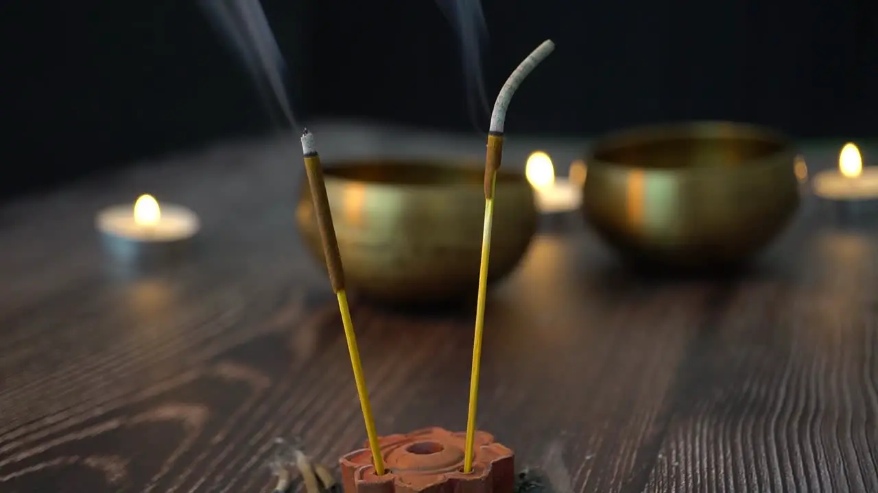 Incense with Tibetan bowls and candles