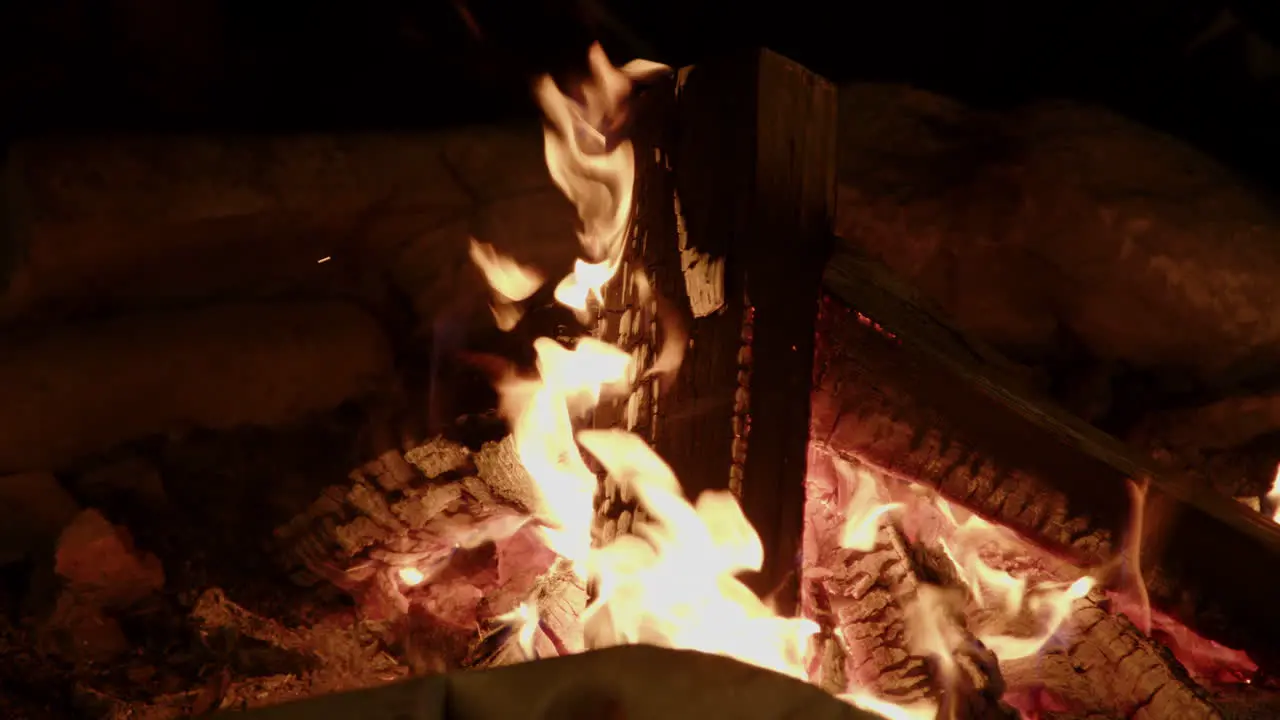 Slow motion campfire in stone fire ring