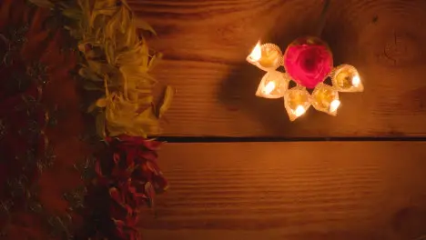 Still Life Of Five Wick Lamp On Table With Green Screen Digital Tablet In Festival Of Diwali