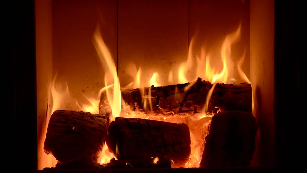 close up of home fireplace with burning flame relaxation chilling concept